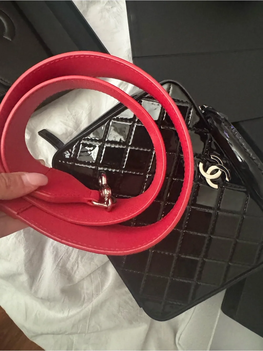 CHANEL Black Quilted Patent Top Handle Vanity Bag with red strap